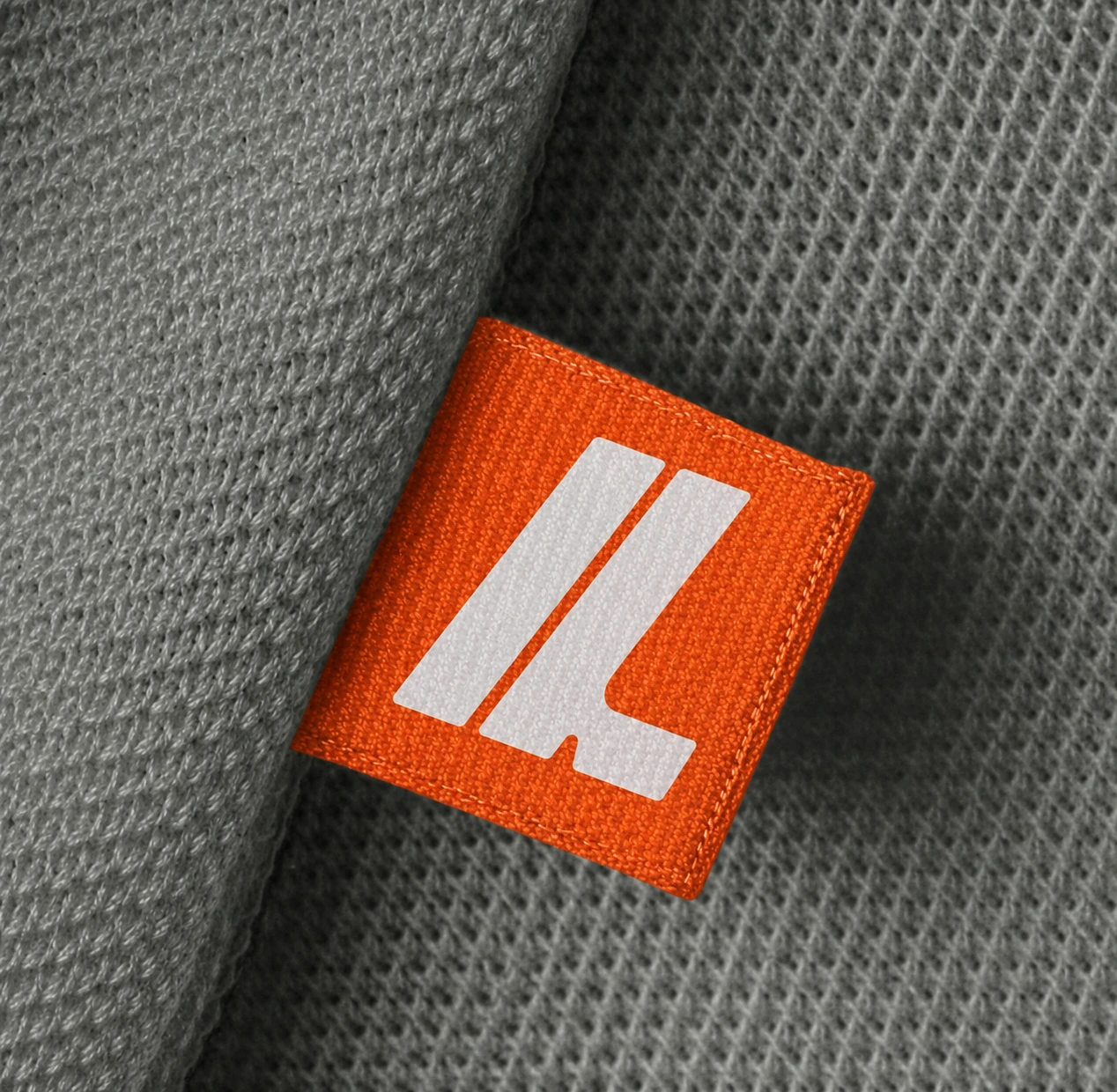 Lyverne’s cream monogram on its orange woven label